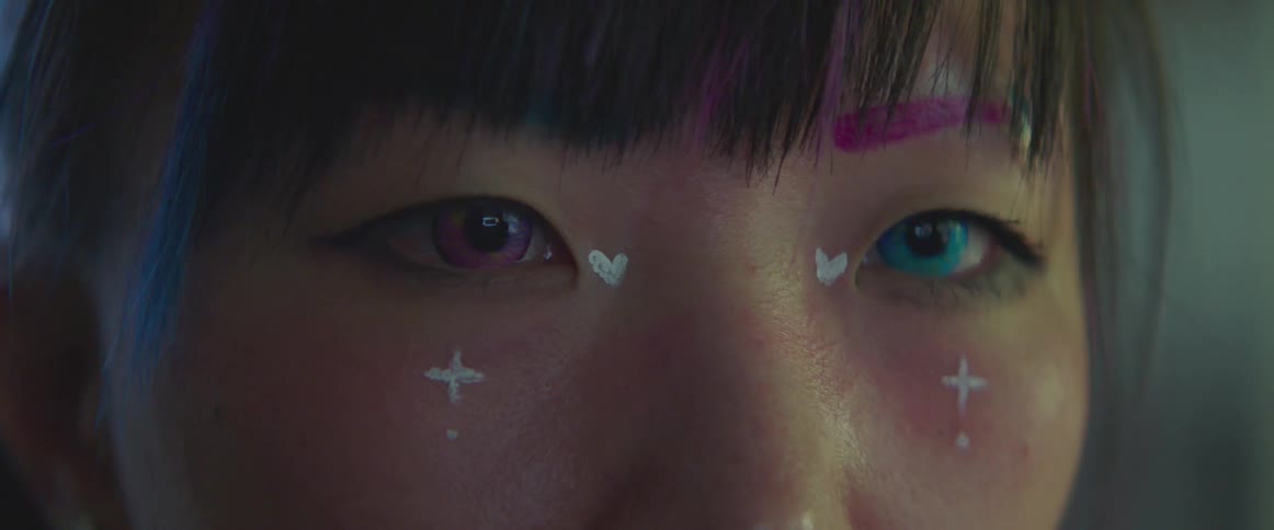 A woman has heavy makeup on