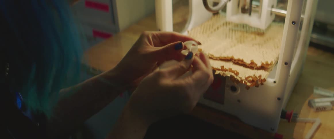 A view of a person assembling a machine