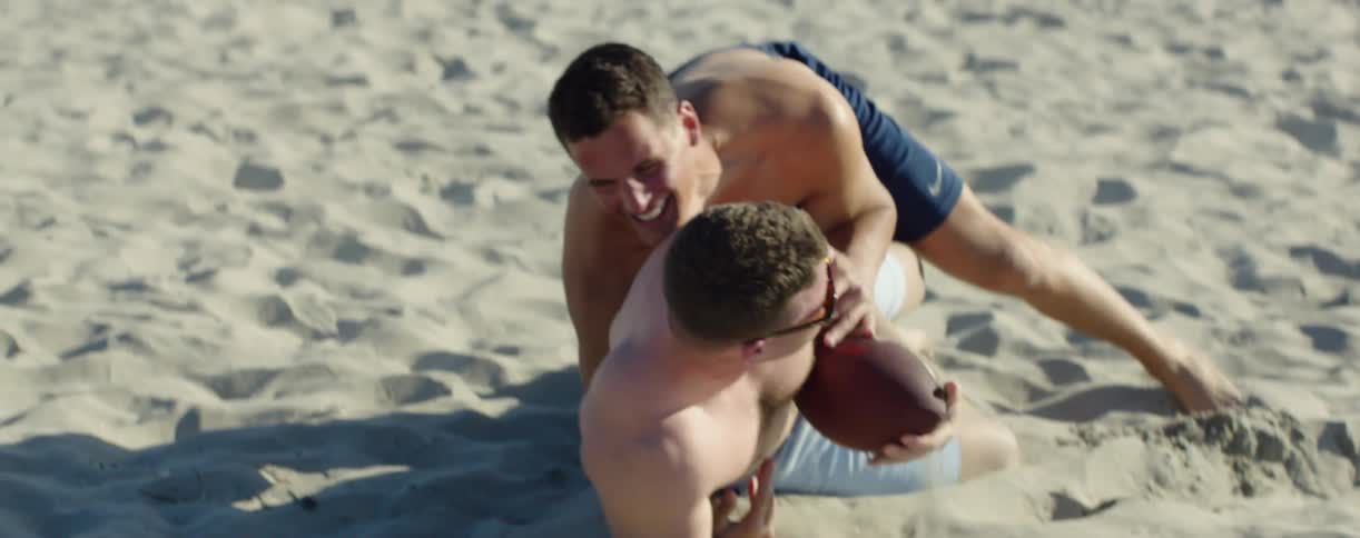 A man gets tackled playing football