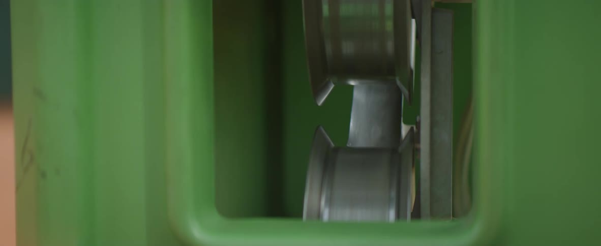 Wheels inside a green window begin to spin and turn