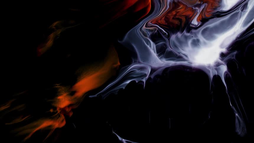 Red and white smoke floats in the air