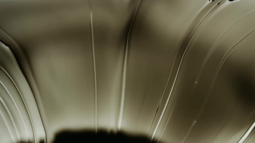 Wave of traditional chinese ink flowing and streaking up over a white background