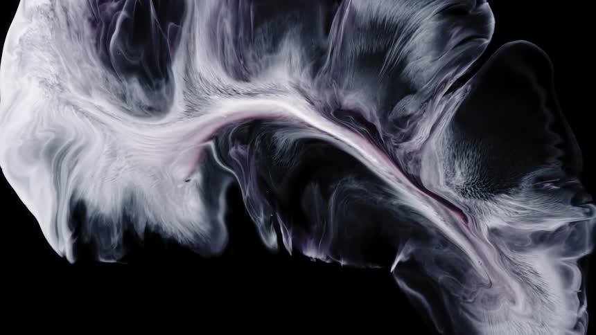 Abstract liquid flows and spreads on black background