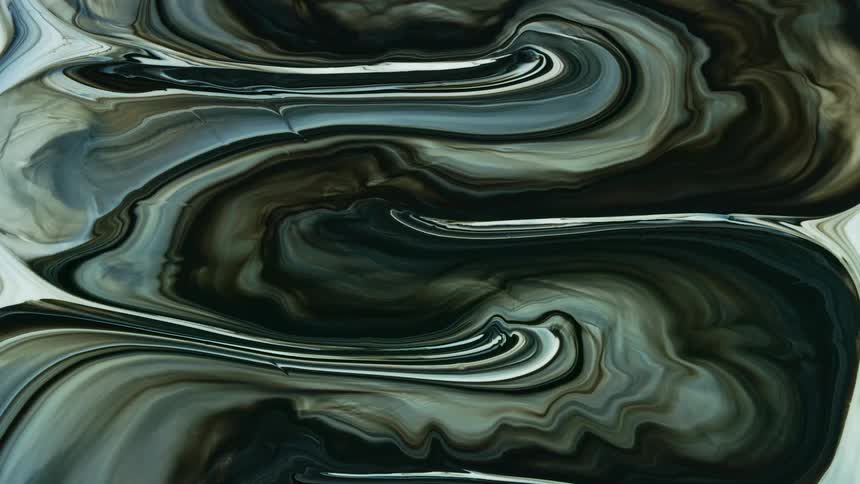 abstract macro footage of marbling colors in brown and white