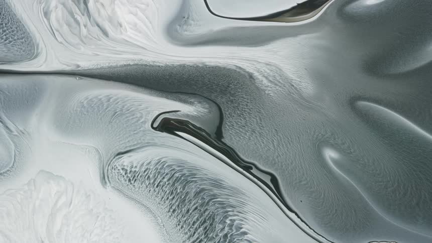 Monochrome abstract mixture of paint in organic motion