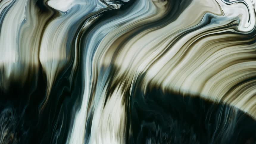 Streaks and streams of silver and white liquid ink flowing over a black background