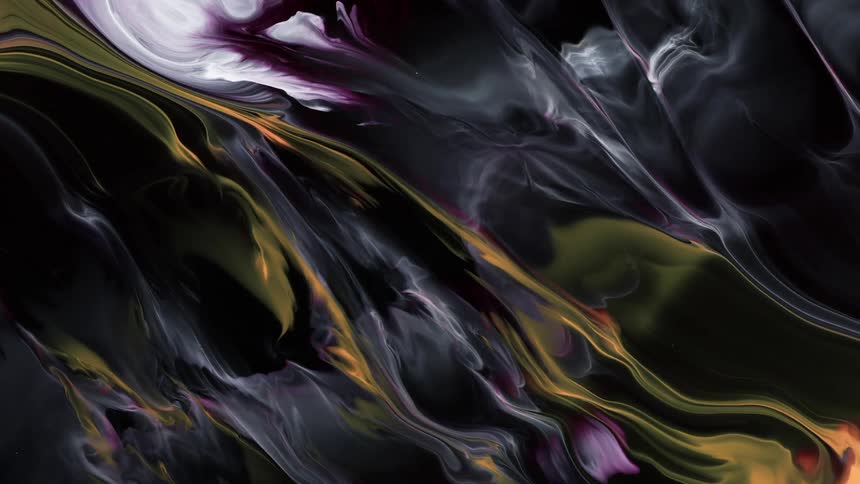 Streaks and streams of orange and green liquid ink flowing over a black background