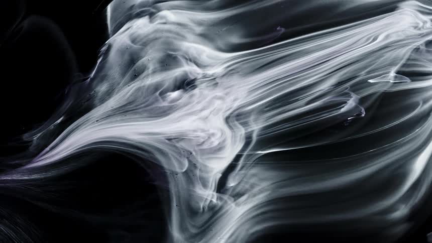 White streaks and swirls stretch across black