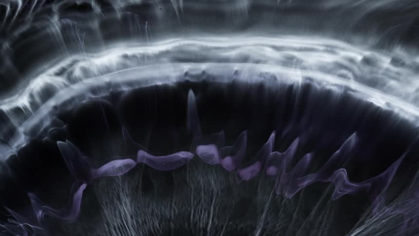 Abstract patterns of clouds of ink in a surreal and dark scenario