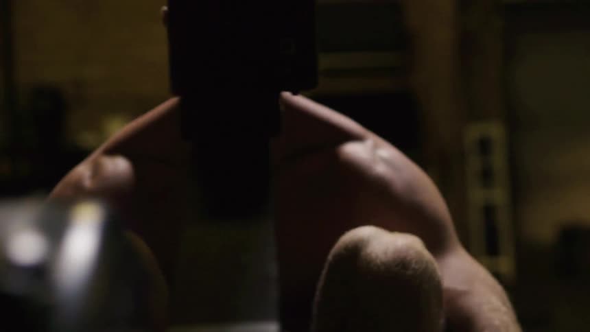 A man uses a machine for an exercise workout