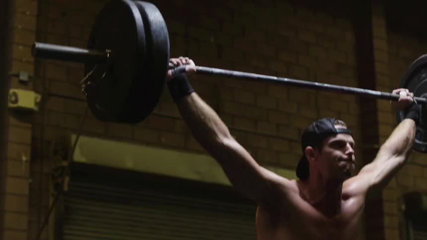 A man deadlifts a weight