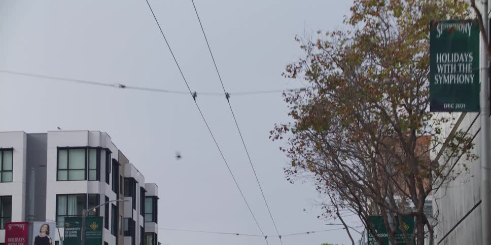 Tram cables and apartment buildings in city street
