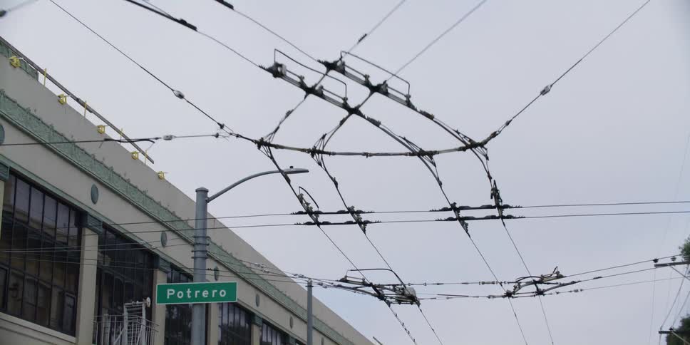 Powerlines are displayed in an urban city