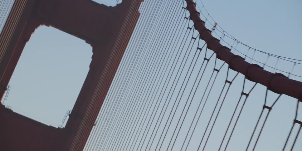 Cars travel over the large bridge