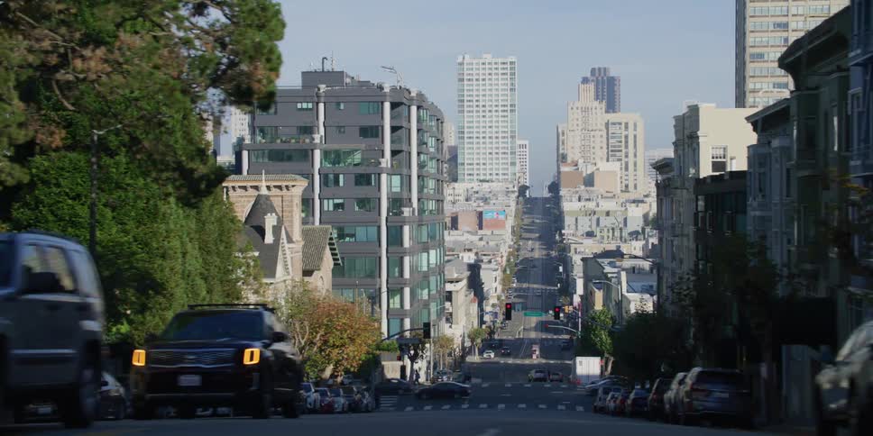 Vehicles drive on the roads through the city