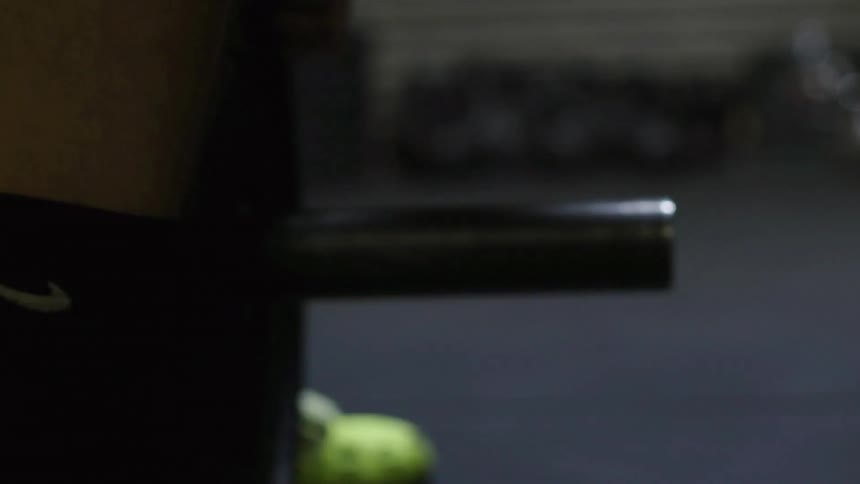 Man adding extra weight to a weight bar