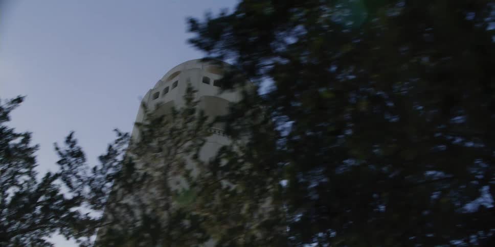 A large stone tower is under the sunny sky