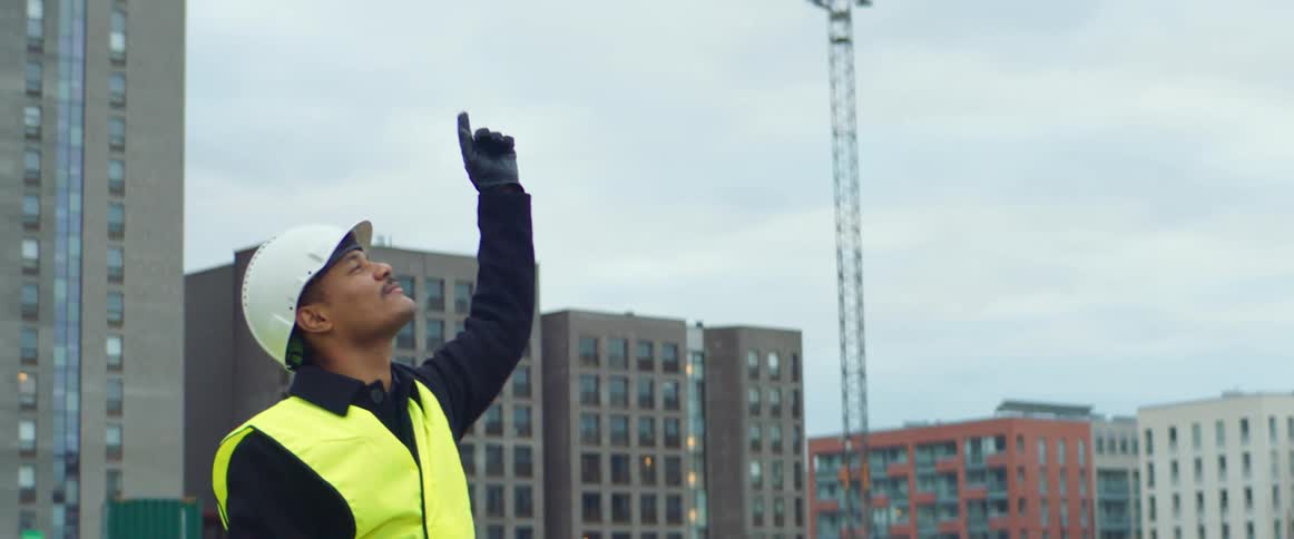 A man is directing on the construction site