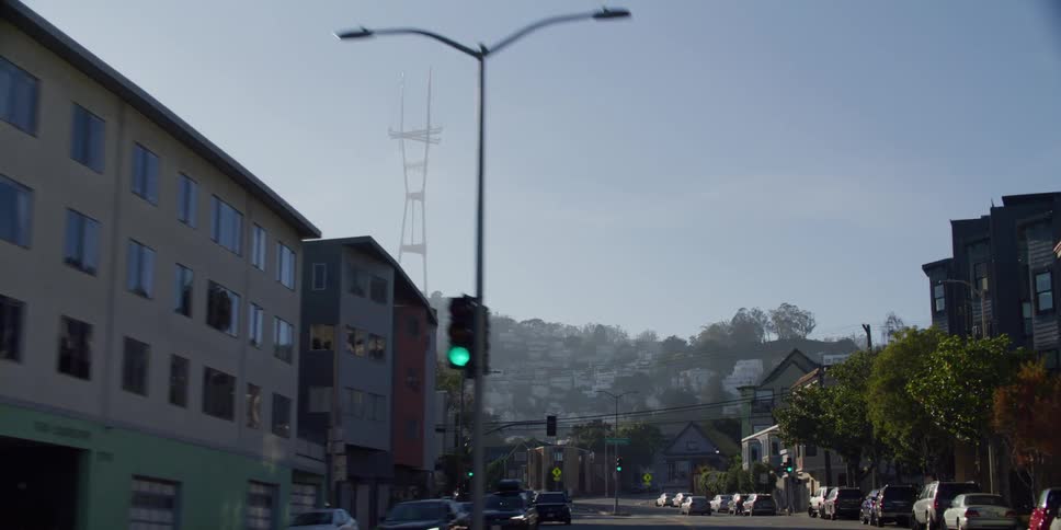 Driving on the street of a neighborhood of a city in the hills in the morning