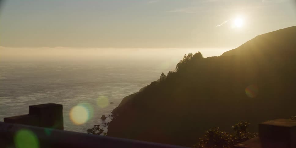 The sun is rising on the coast