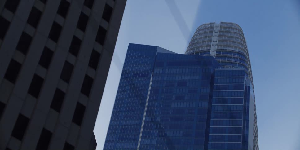 Three big buildings with multiple windows at a sunny day
