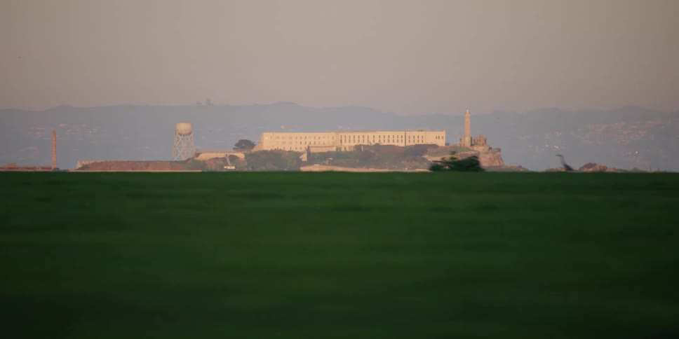 View of grassy plains is displayed near a city