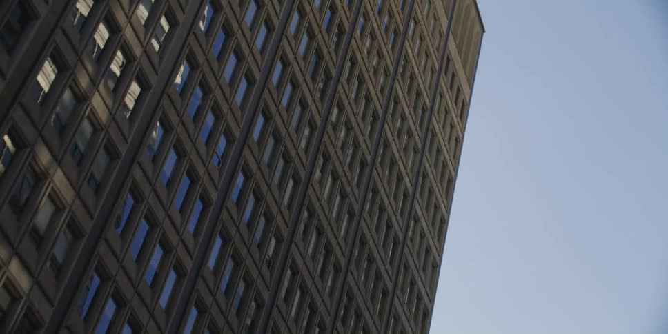 The buildings are tall and full of windows