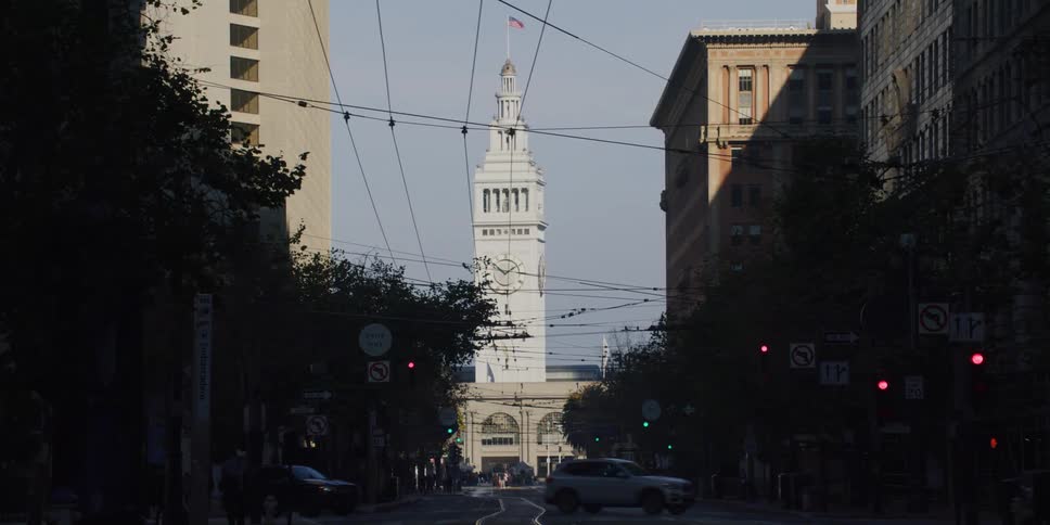 Driving near the san francisco ferry building clock tower at morning