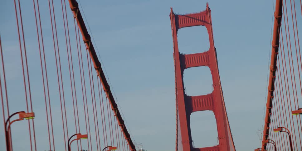 The golden gate bridge towers in the sky