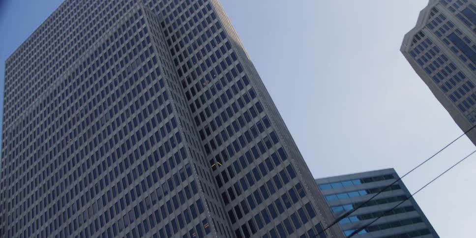 Skyscrapers of varying heights fill a city skyline