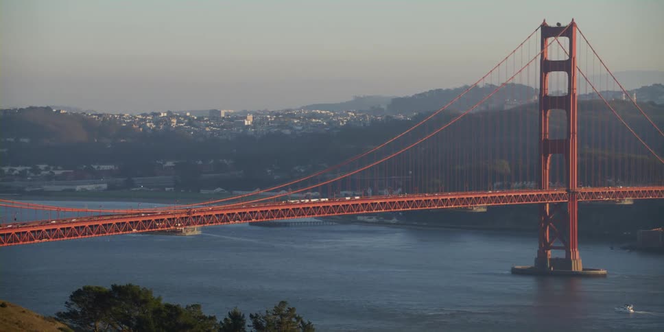 An elevated view of the golden gate bridge in the early evening on a hazy day