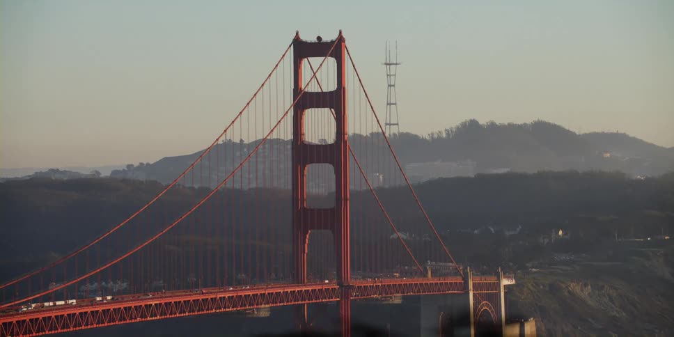 Cars parked in front of the golden gate bridge on san francisco bay