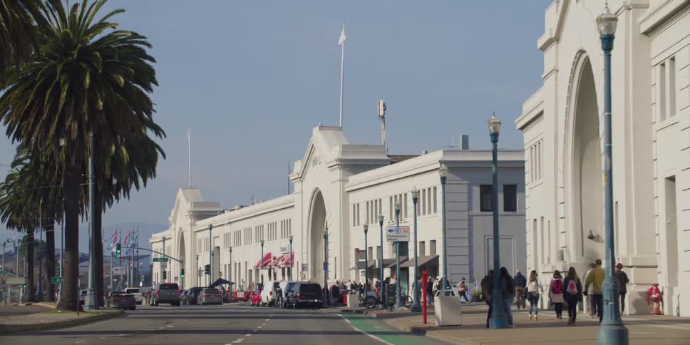 People are walking and driving in the city