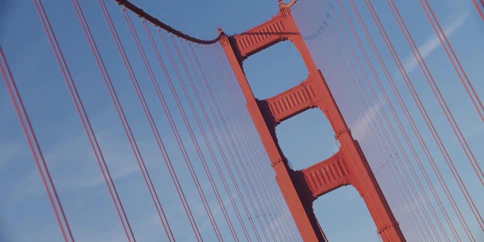 Traffic moves along large bridge