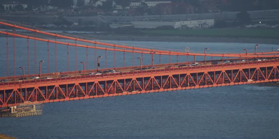 Traffic crossing over the golden gate bridge at morning