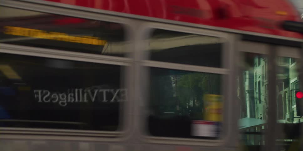 Bus driving in front a san francisco residential street at morning