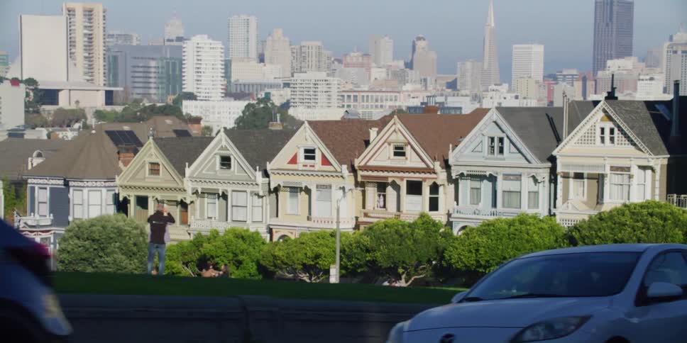 Cars are parked in a downtown city in spring