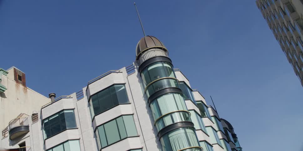 An office building on kearny street in jackson square with a spire and dome