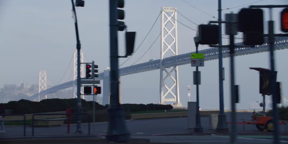 Suspension bridge with suspension cables on vertical suspenders seen from a moving car