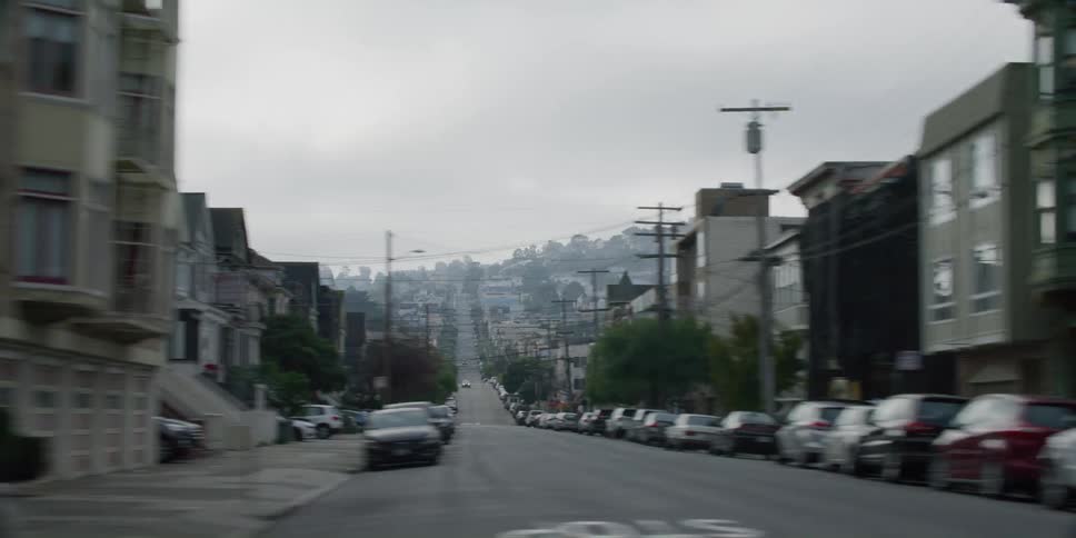 City neighbourhood with cars sitting on streets