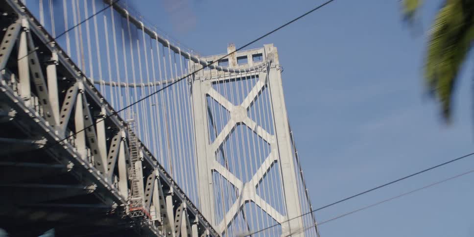 Dramatic zoom while driving under the oakland bridge in san francisco