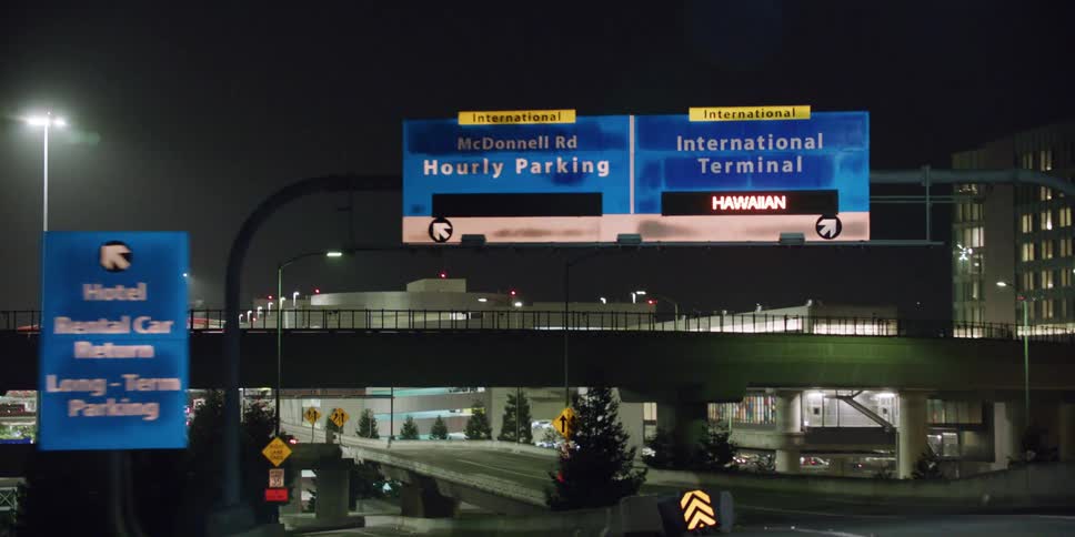 An interstate is displayed in a city at night