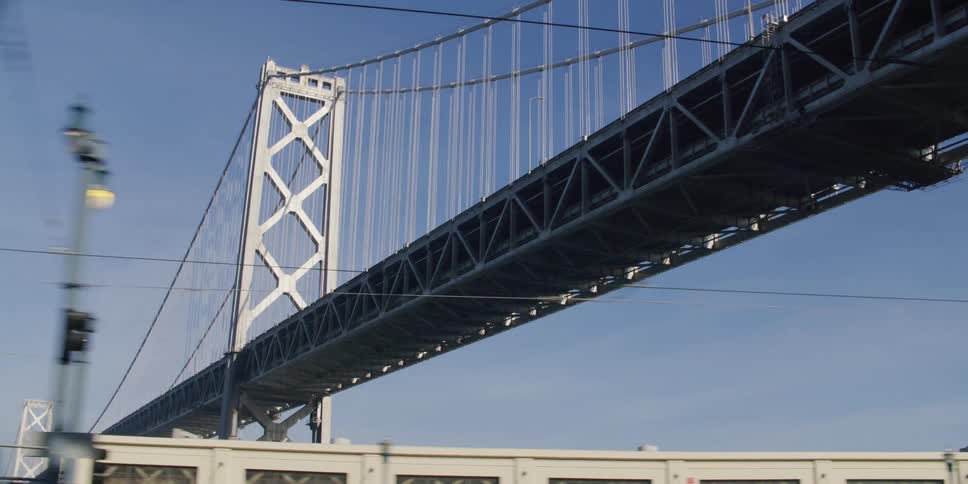 A bridge is displayed in a city during the daytime