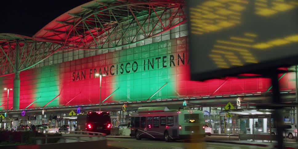 Driving near the colorful red and green facade of the san francisco international airport terminal