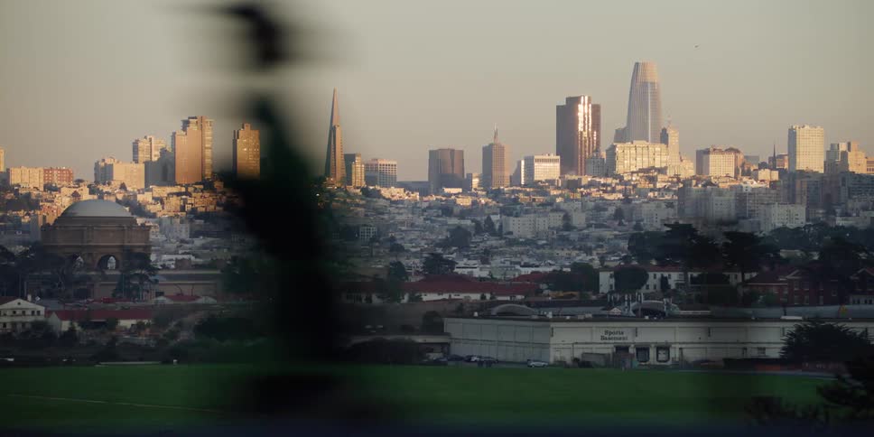 Traveling past the san francisco city skyline with skyscrapers and neighborhoods