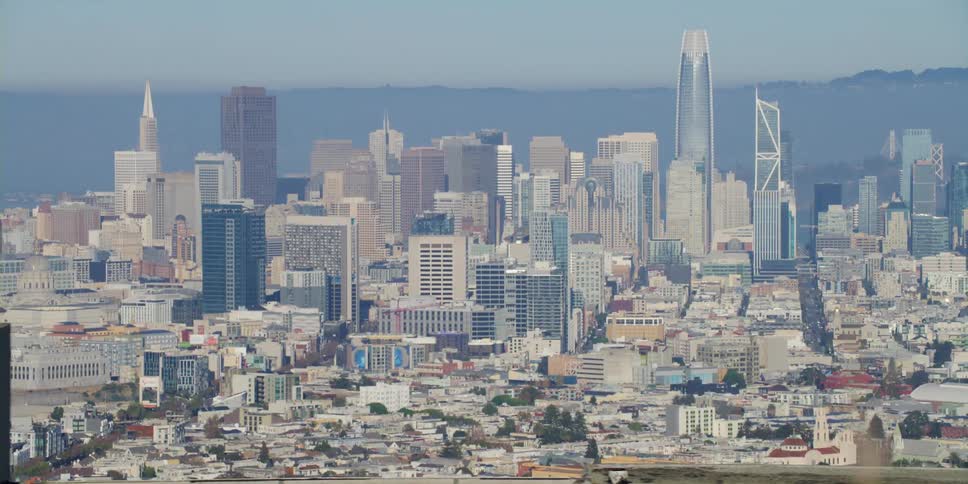Fog covers city scape and the horizon