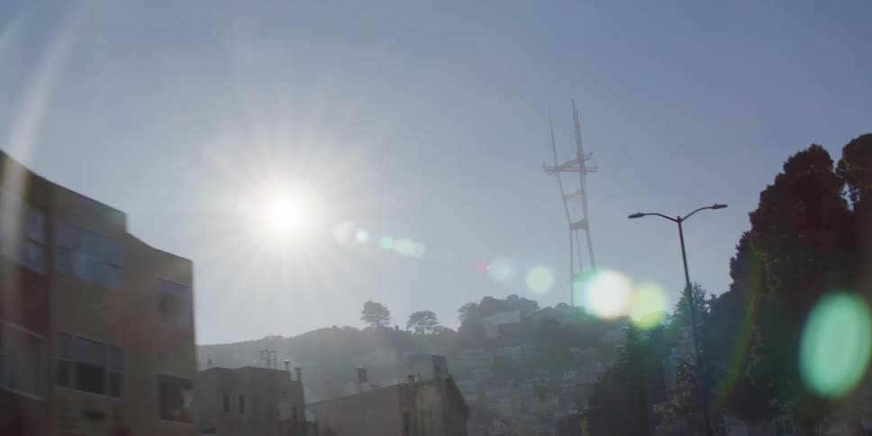 Sutro tower standing on a hill top overlooking neighborhood homes and streets