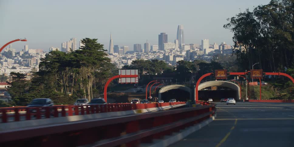 Traffic drives on a bridge in and out of downtown