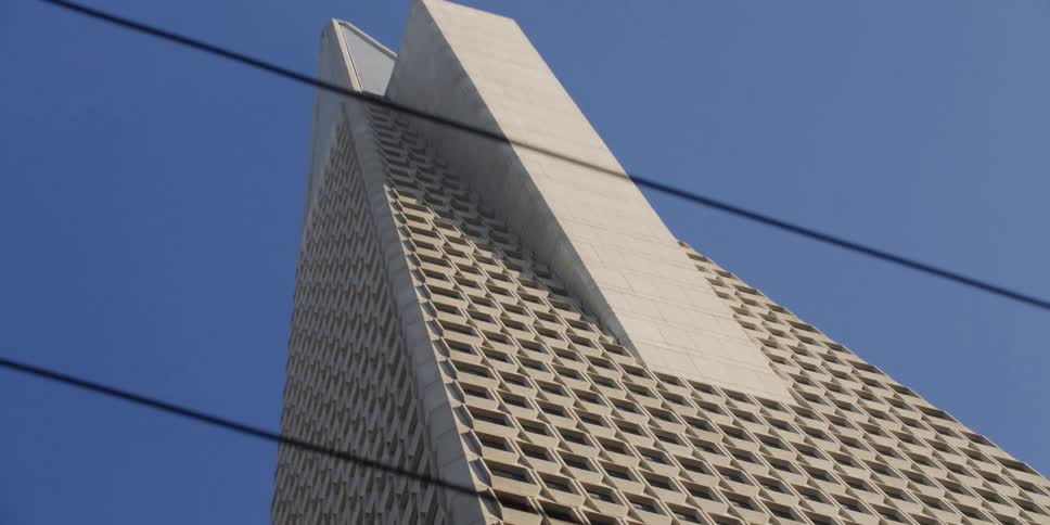 Tall triangular building with multiple windows
