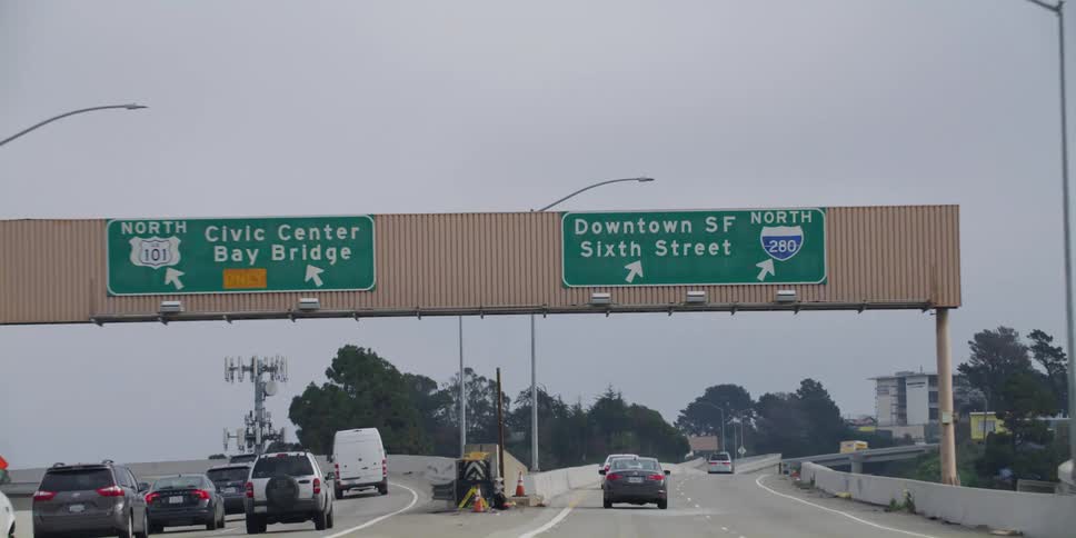 Vehicles drive along a highway leading to downtown san francisco